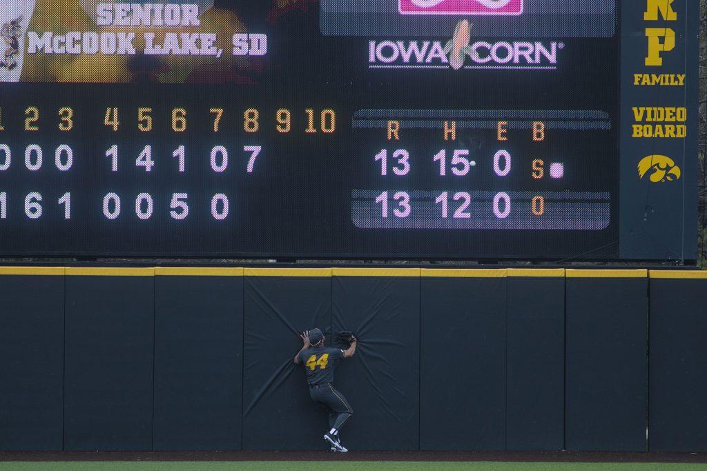 Mizzou outfielder Zach Hanna attempts to catch a home run during the Iowa/Mizzou baseball game at Duane Banks Field on Tuesday, May 1, 2018. The Tigers defeated the Hawkeyes, 17-16, with two extra innings. (Lily Smith/The Daily Iowan)