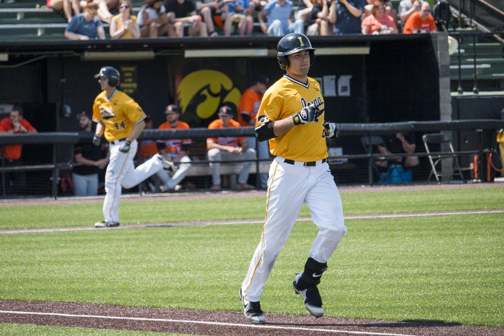 Iowa infielder Kyle Crowl runs to first base during baseball Iowa vs. Oklahoma State at Duane Banks Field on May 6, 2018. The Hawkeyes defeated the Cowboys 11-3.  (Katina Zentz/The Daily Iowan)