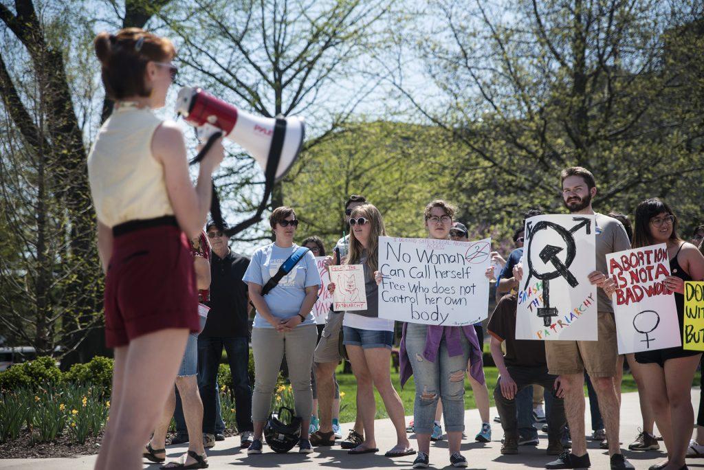 Protestors gather on the Pentacrest to oppose Iowas heartbeat bill on May 5, 2018. The bill, signed by Iowa Governor Kim Reynolds on Friday, bans abortions if a fetal heartbeat has been detected—usually at about six weeks of pregnancy. The law will go into effect July 1. (The Daily Iowan/Olivia Sun)