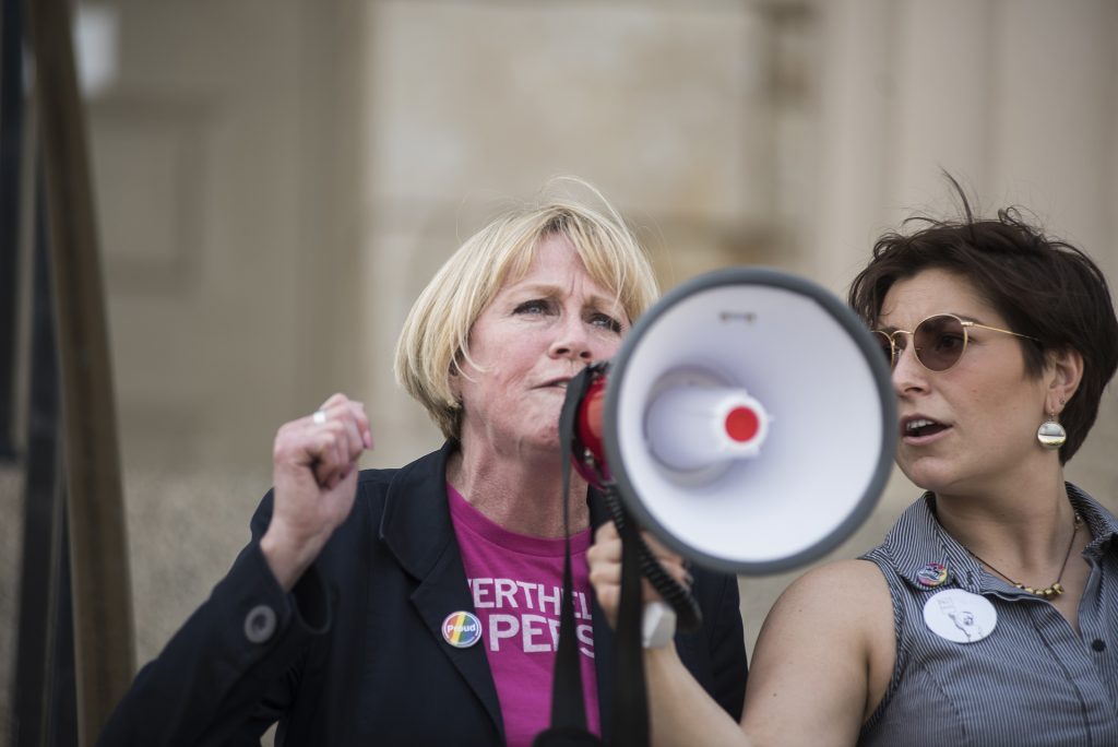 Gubernatorial candidate Cathy Glasson speaks to a crowd on the Pentacrest in Iowa City on Saturday, May 5. Glasson is running on a platform that focuses on issues relating to universal healthcare, gun regulations, and equal pay. (Ben Allan Smith/The Daily Iowan)