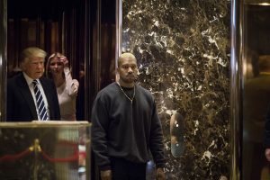 U.S. President-elect Donald J. Trump and Musician Kanye West pose for photographers in the lobby of Trump Tower on Dec. 13, 2016 in Manhattan, New York. (Photo by John Taggart/Sipa USA/TNS)