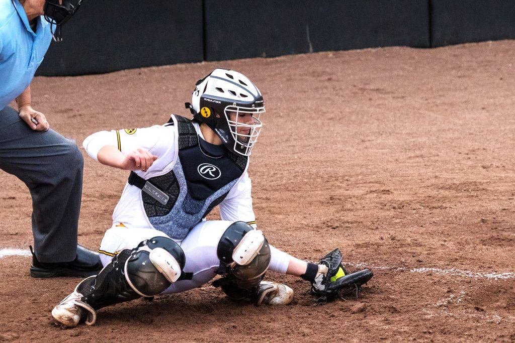 University of Iowa softball player Angela Schmiederer catches a ball in the dirt during a game against the University of Minnesota on Thursday, Apr. 12, 2018. The Gophers defeated the Hawkeyes 8-0. (David Harmantas/The Daily Iowan)