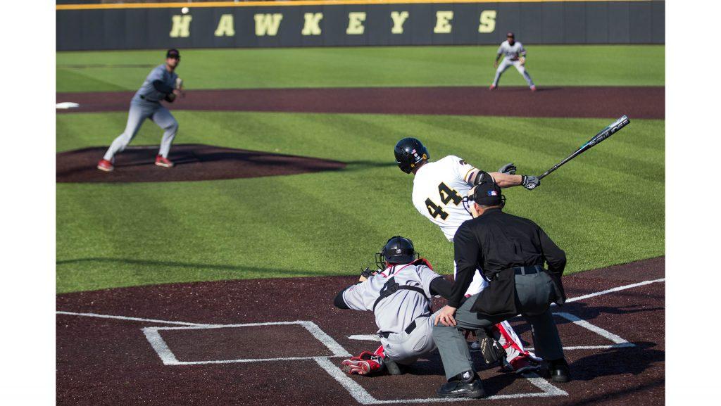 Junior Robert Neustrom follows through his swing during Iowa baseball vs. Northern Illinois at Banks Field on April 17, 2018. The Hawkeyes won the game 2-0. (Megan Nagorzanski/The Daily Iowan)