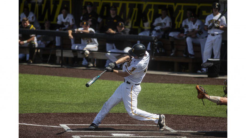 Iowa outfielder Robert Neustrom makes contact during Iowas game against Oklahoma State at Duane Banks Field on Saturday May 5, 2018. The Hawkeyes defeated the Cowboys 16-14. (Nick Rohlman/The Daily Iowan)