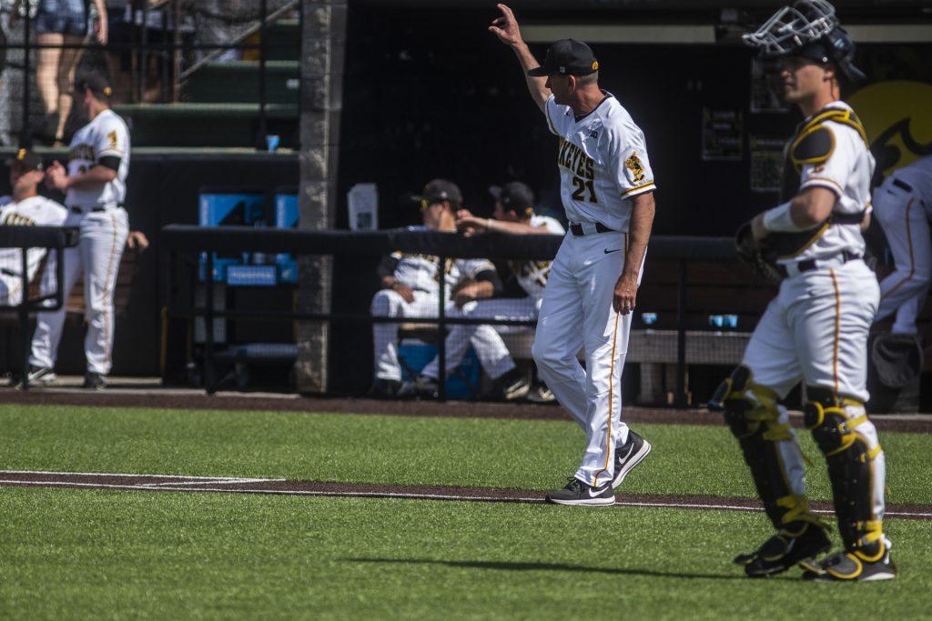 Iowa head coach Rick Heller calls to the bullpen for a pitching change during Iowas game against Oklahoma State at Duane Banks Field on Saturday May 5, 2018. The Hawkeyes defeated the Cowboys 16-14. 