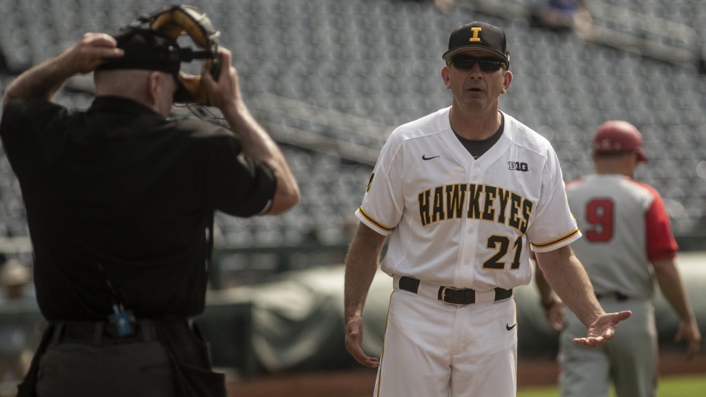 Iowa Head Coach Rick Heller questions the Home Plate Umpire during Iowas Big Ten tournament game against Ohio State on Thursday, May 24, 2018. The Buckeyes defeated the Hawkeyes 2-0. 