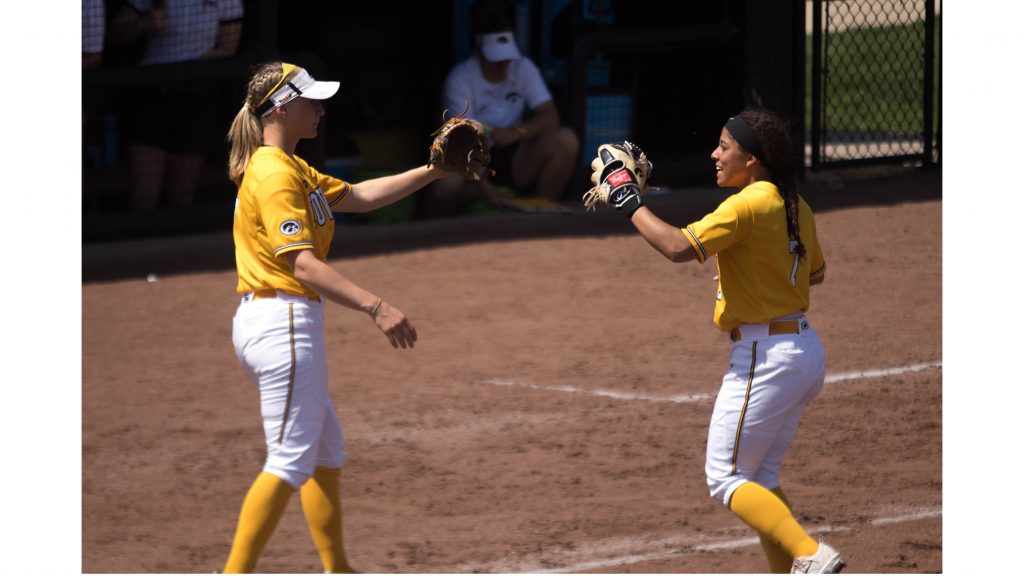 Lea Thompson high fives teammate during Iowas game against Purdue at Pearl Field on May 5, 2018. The Hawkeyes were defeated 9-0. (Megan Nagorzanski/The Daily Iowan)