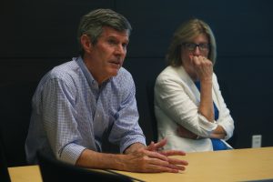 Democratic gubernatorial candidate Fred Hubbell and Lt. Gov. nominee state Sen. Rita Hart, D- Wheatland, listen to a presentation given at the Kirkwood Regional Center on June 18. (Tate Hildyard/The Daily Iowan)