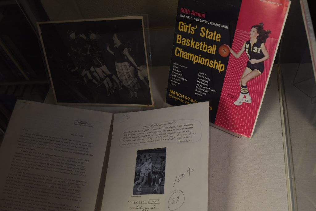 A women's 6-on-6 pamphlet and signed book on display in the Women's Archive at the Main Library, June 27, 2018. The women's 6-on-6 archive is on display all across Iowa this summer. (Paxton Corey/The Daily Iowan)