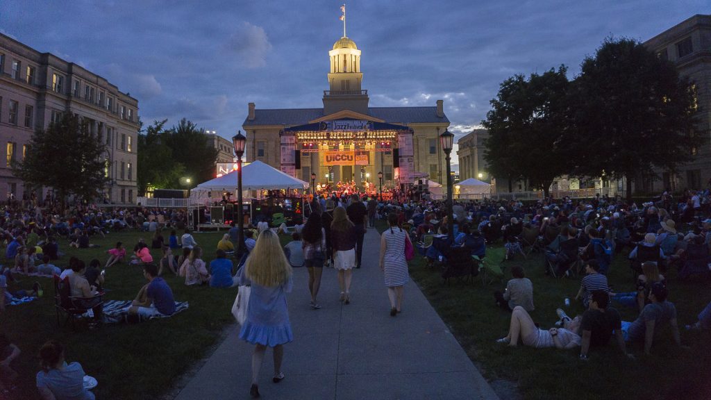 Spectators head to their seats for the headlining act during the night concert at the 2017 Jazz Fest on June 30th 2017. (File Photo/The Daily Iowan)