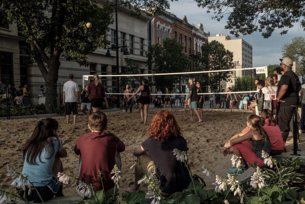 Partygoers play sand volleyball during the Iowa City Downtown District Block Party on Saturday June 23, 2018. The 2nd annual event during which open containers were allowed in a select portion of downtown attracted thousands of guests and featured a variety of activities and performances. (Nick Rohlman/The Daily Iowan)