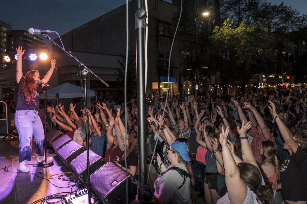 Partygoers dance to a performance by Flint Eastwood during the Iowa City Downtown District Block Party on Saturday June 23, 2018. The 2nd annual event during which open containers were allowed in a select portion of downtown attracted thousands of guests and featured a variety of activities and performances. (Nick Rohlman/The Daily Iowan)