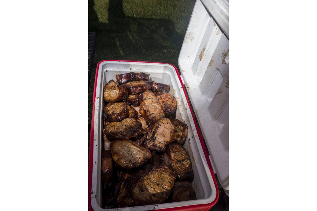 Pork Chops sit in a cooler outside of Wellman, Iowa during RAGBRAI on Friday, July 27, 2018. Riders rode from Sigourney to Iowa City on Day 6 of this years ride. (Nick Rohlman/The Daily Iowan)