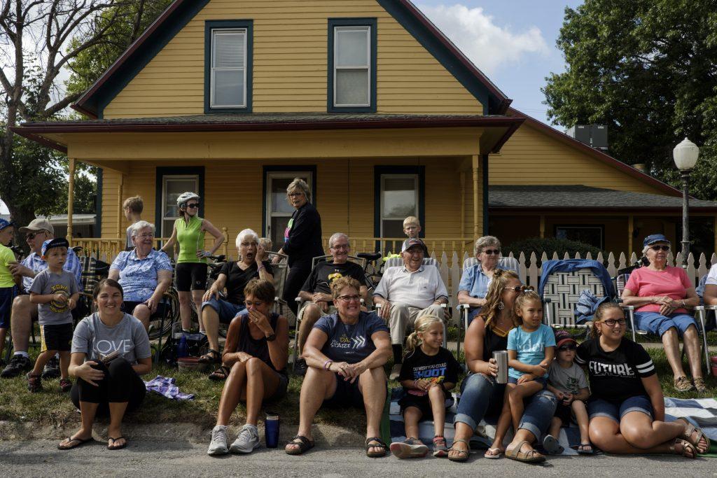 Members of The Lower Deer Creek Church welcome riders to Kalona, Iowa during RAGBRAI on Friday, July 27, 2018. Riders rode from Sigourney to Iowa City on Day 6 of this years ride. (Nick Rohlman/The Daily Iowan)