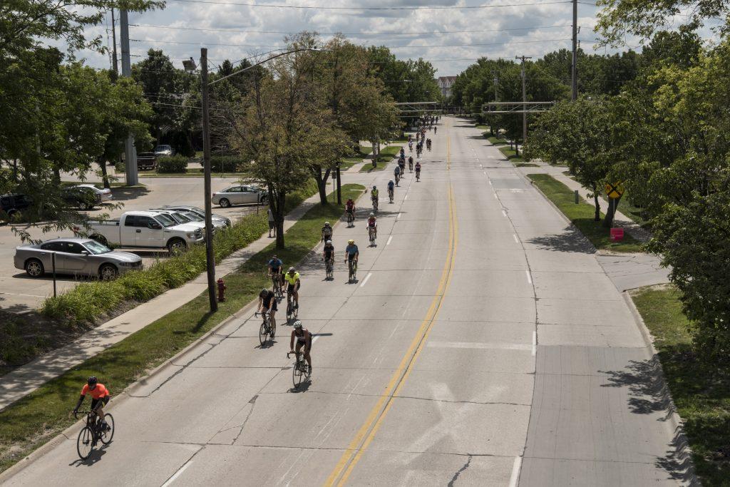 Riders ride on Gilbert Street in Iowa City, Iowa during RAGBRAI on Friday, July 27, 2018. Riders rode from Sigourney to Iowa City on Day 6 of this years ride. (Nick Rohlman/The Daily Iowan)