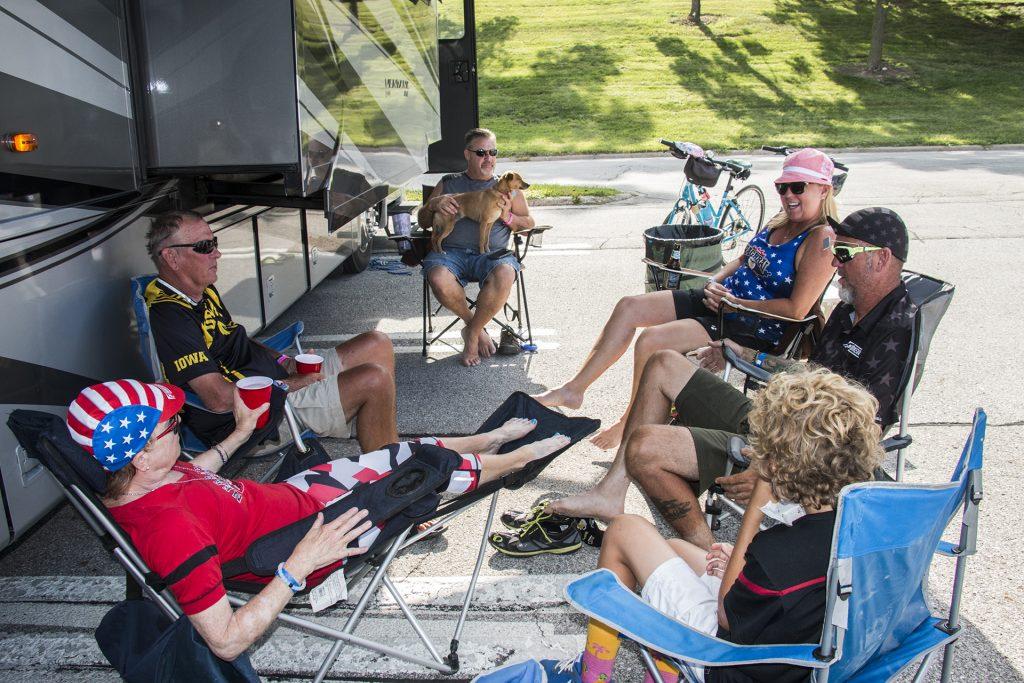 The Watson family sits down to relax during RAGBRAI on July 27, 2018. Riders rode from Sigourney to Iowa City on Day 6 of this year's event. (Katina Zentz/The Daily Iowan)