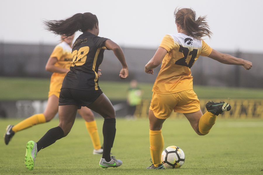 Iowa's Emma Tokuyama attempts a pass during a soccer match between Iowa and Missouri at the Iowa Soccer Complex on Friday, August 17, 2018. The Hawkeyes drew the Tigers, 0-0.