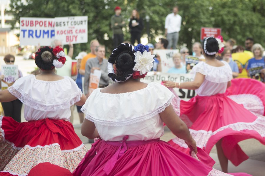 Dancers twirl in sync to the music during a performance for protestors outside the Eighth Circuit Judicial Conference at the Iowa Events Center in Des Moines on Friday, Aug. 17, 2018. The conference included speakers including Attorney Justice Jeff Sessions and Supreme Court Justice Neil Gorsuch.