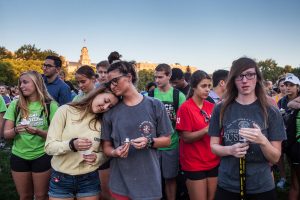 Community members gather to pay their respects during a vigil in memory of UI student Mollie Tibbetts at Hubbard Park on Wednesday, Aug. 22, 2018. Tibbetts went missing on July 18, in Brooklyn, Iowa. 