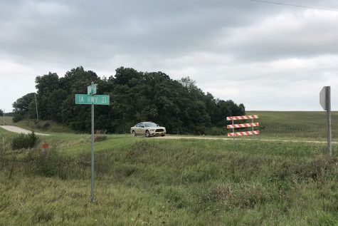 An Iowa State Patrol car sits behind a closed road sign on 385th Avenue outside of Brooklyn, Iowa near the site of where UI Mollie Tibbetts’ body was found Aug. 21.