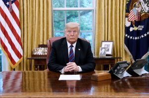 U.S. President Donald Trump listens to Mexican President Enrique Pena Nieto during a phone conversation on Monday, Aug. 27, 2018 to announce the United States-Mexico Trade Agreement in the Oval Office of the White House in Washington, D.C. 
