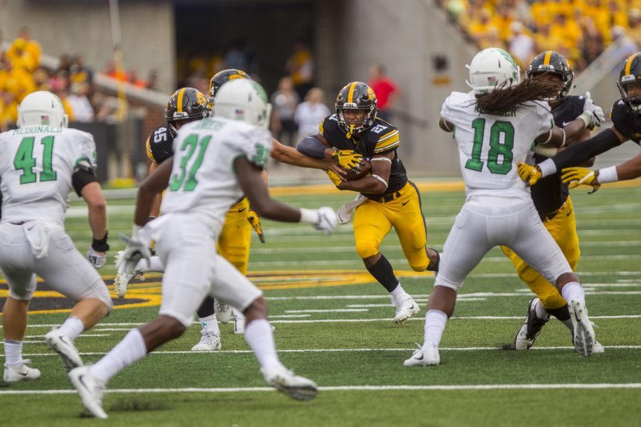 Iowas Ivory Kelly-Martin takes the handoff during the game between Iowa and North Texas at Kinnick Stadium on Saturday Sept. 16, 2017. Iowa won 31-14. (Nick Rohlman/The Daily Iowan)