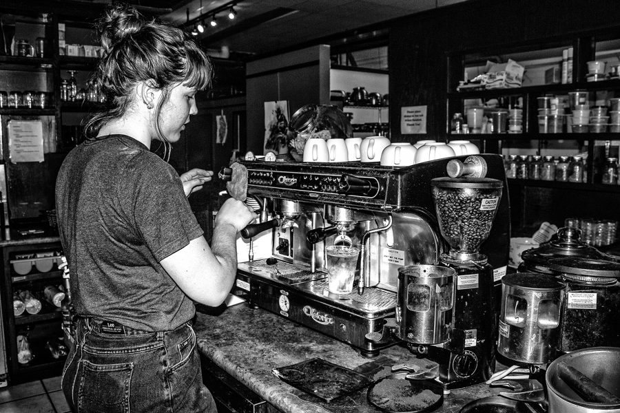 UI junior Lou Krieger-Coen makes a vegan latte at Fair Grounds Coffeehouse on Wednesday, Aug. 29, 2018. "This place is great because we offer lots of vegan options," Krieger-Coen said. "I come in almost every morning and bake vegan muffins. It's my favorite thing."