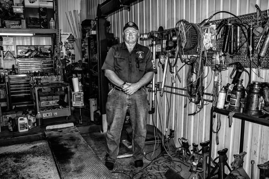 Johnson County supervisor candidate Phil Hemingway stands for a portrait in his mechanic’s shop on Wednesday, Aug. 22, 2018. 