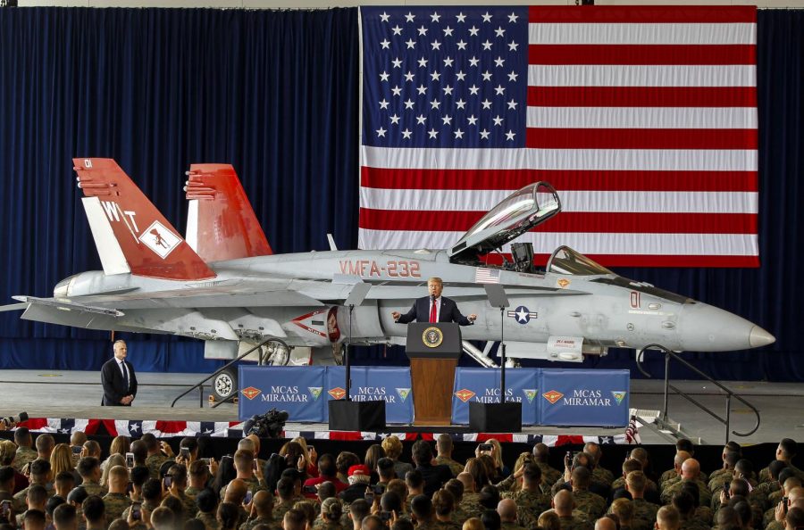 With+a+F%2FA-18+Hornet+behind+him%2C+President+Donald+Trump+speaks+to+Marines+at+Marine+Corps+Air+Station+Miramar+in+San+Diego%2C+Calif.+on+March+13%2C+2018.+%28Hayne+Palmour+IV%2FSan+Diego+Union-Tribune%2FTNS%29