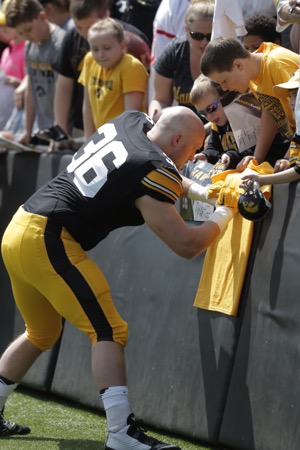 Iowa fullback Brady Ross signs a fans shirt at Kinnick Stadium on April 23, 2016. The defense beat the offense 20-18 in the spring game. 