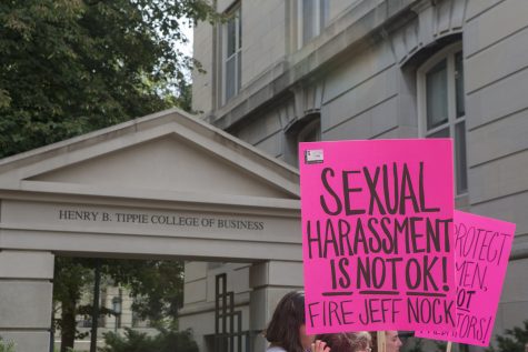 A protester holds their sign during the Jeffery Nock protest outside of the Pappajohn Business Building on Aug. 30, 2018. Students and faculty turned out to protest Professor Jeffery B. Nock, who is still employed at the university despite issued a criminal trespass warning after allegedly taking photographs of women at the Campus Recreation and Wellness Center. 