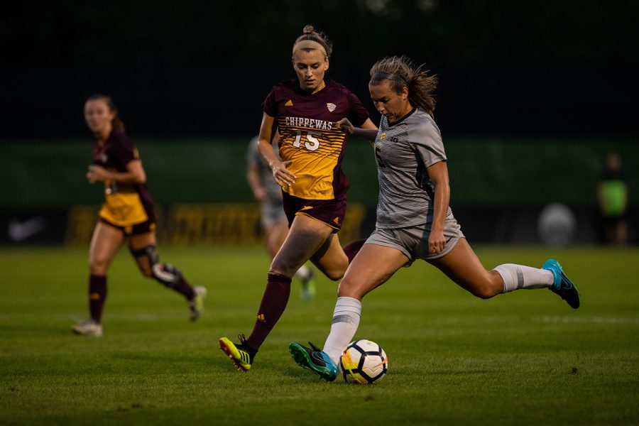 Iowa defender Riley Whitaker crosses the ball during Iowas game against Central Michigan on Friday, Aug. 31, 2018. The Hawkeyes defeated the Chippewas 3-1.