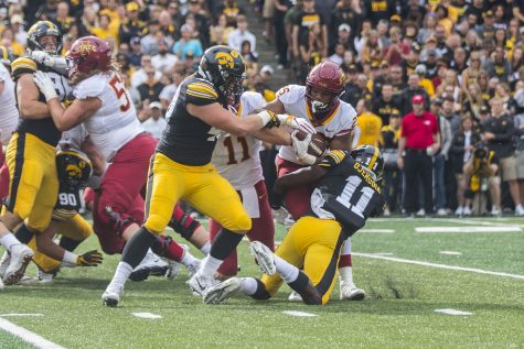 Iowa States Sheldon Croney Jr gets tackled by Iowa defense during the Iowa/Iowa State football game at Kinnick Stadium on Saturday, September 8, 2018. The Hawkeyes defeated the Cyclones, 13-3.