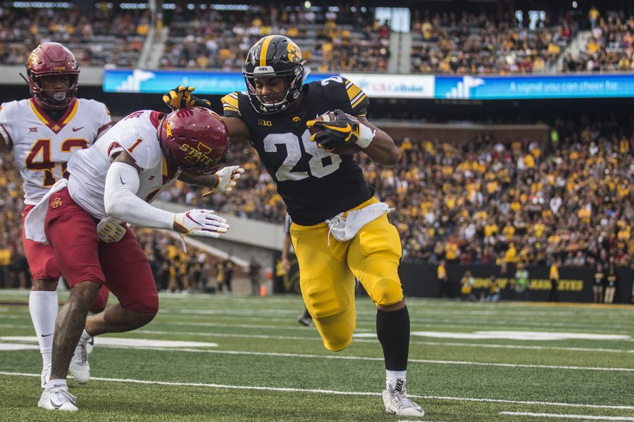 Iowas Toren Young attempts to stop Iowa States DAndre Paynes tackle during the Iowa/Iowa State football game at Kinnick Stadium on Saturday, September 8, 2018. The Hawkeyes defeated the Cyclones, 13-3.