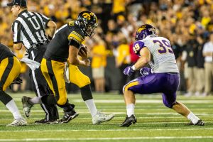 Iowa Hawkeyes quarterback Nate Stanley (4) squares up for contact during a game against Northern Iowa at Kinnick Stadium on Saturday, Sept. 15, 2018. The Hawkeyes defeated the Panthers 38–14. 