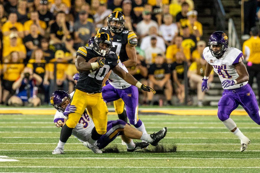 Iowa Hawkeyes running back Mekhi Sargent (10) tries to run through a tackle during a game against Northern Iowa at Kinnick Stadium on Saturday, Sep. 15, 2018. The Hawkeyes defeated the Panthers 38–14. (David Harmantas/The Daily Iowan)
