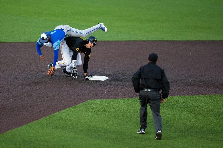 A Bluejays player collides with outfielder Zeb Abreon during Iowa's game against Ontario Blue Jays at Duane Banks Field on September 21, 2018. 