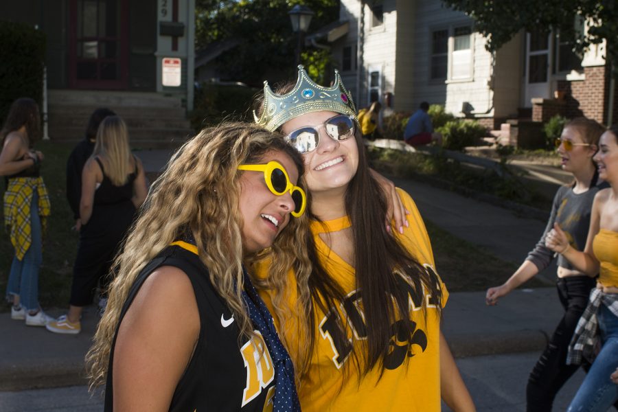 Fans pose for a portrait on Saturday, September 22, 2018. Both Hawkeye and Badger fans tailgated throughout Iowa City prior to the Iowa vs. Wisconsin  football game. (Katina Zentz/The Daily Iowan)