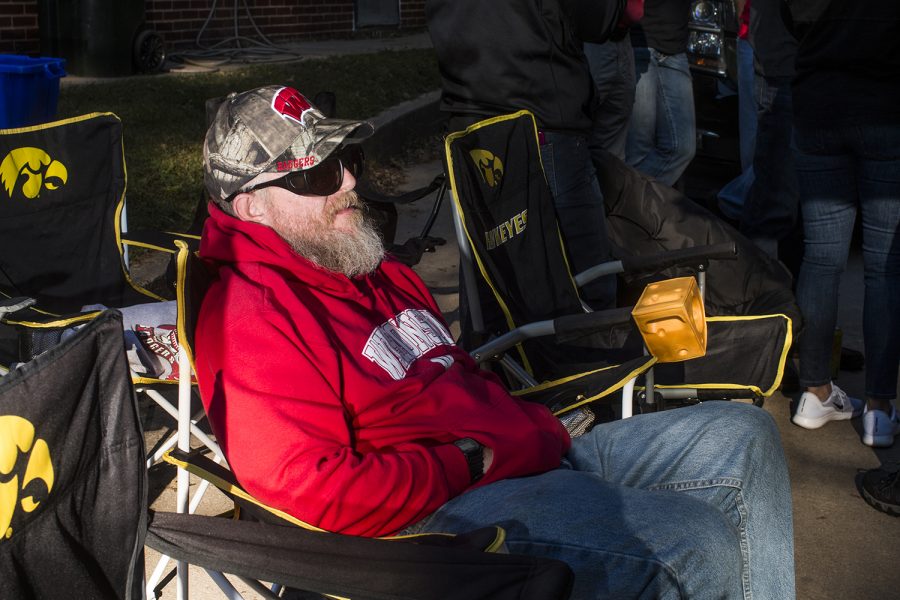 A Badger fan watches TV on Saturday, September 22, 2018. Both Hawkeye and Badger fans tailgated throughout Iowa City prior to the Iowa vs. Wisconsin  football game. (Katina Zentz/The Daily Iowan)