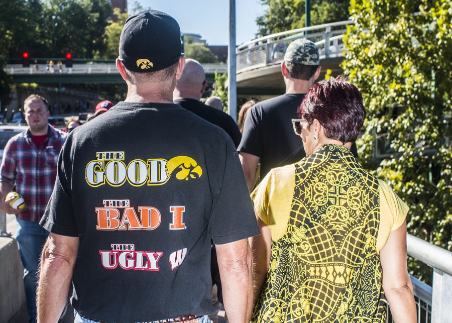 Fans walk toward Kinnick Stadium on Saturday, September 22, 2018. Both Hawkeye and Badger fans tailgated throughout Iowa City prior to the Iowa vs. Wisconsin  football game. (Katina Zentz/The Daily Iowan)