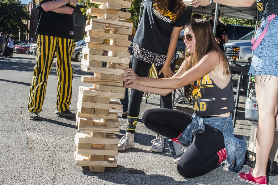 UI Junior Alexandra Ohm plays Jenga on Saturday, September 22, 2018. Both Hawkeye and Badger fans tailgated throughout Iowa City prior to the Iowa vs. Wisconsin  football game. (Katina Zentz/The Daily Iowan)