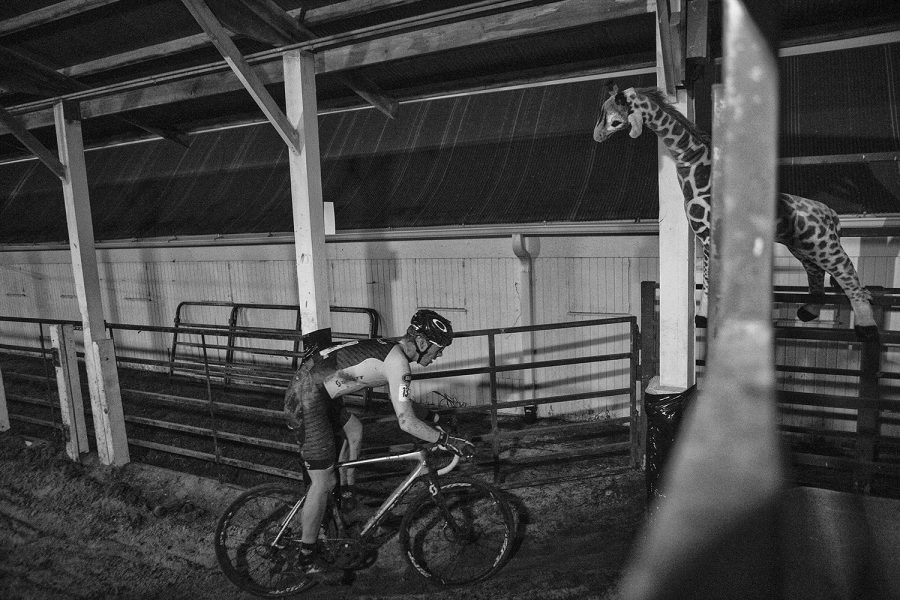 The United State's Ross Ellwood bikes through a barn during Jingle Cross Cyclo-Cross festival on Sept. 28, 2018. Belgium's Diether Sweeck won the men's race with a time of 56:21.