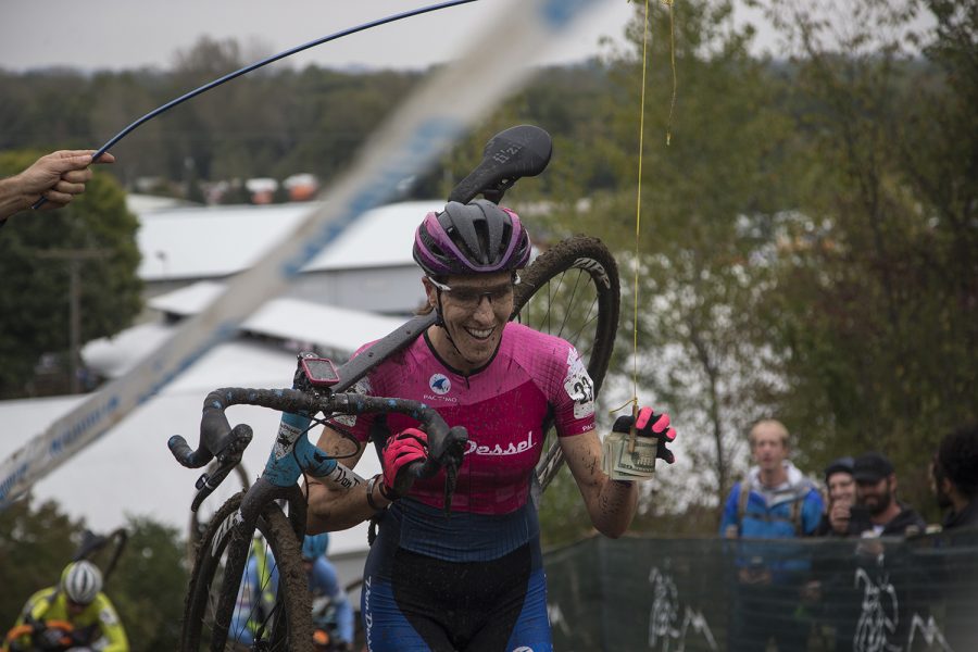 Emma Swartz of the United States reaches for the money during the third day of Jingle Cross on the Johnson County Fairgrounds on Sunday, Sept. 30, 2018. Katerina Nash of the Czech Republic won the UCI Elite Women's Category one race with a time of 44:43. Swartz finished 13th.