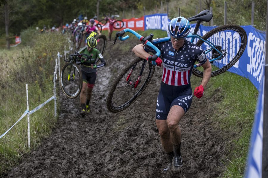 The United States' Katherine Compton leads a group of riders through an off-camber, double track section of the course known as the "Holly Jolly Hell Hole" during the UCI Elite C1 race at the Jingle Cross Cyclo-Cross festival on Sunday, Sept. 30, 2018.