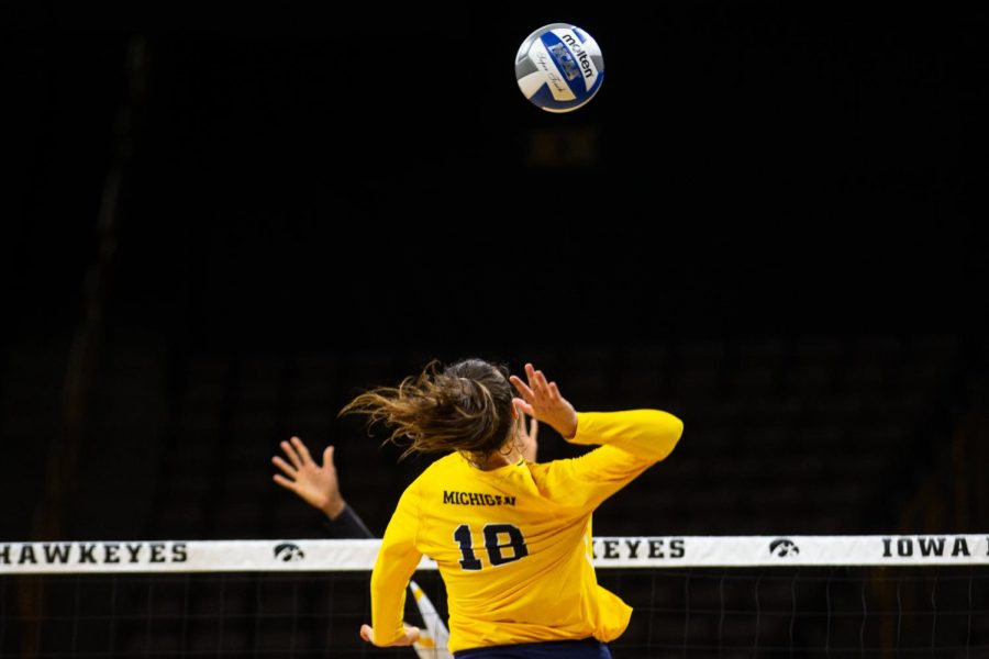 Michigan's Jenna Lerg spikes the ball during Iowa's match against Michigan at Carver-Hawkeye Arena on Sept. 23, 2018. The Hawkeyes were defeated, 3-1. 