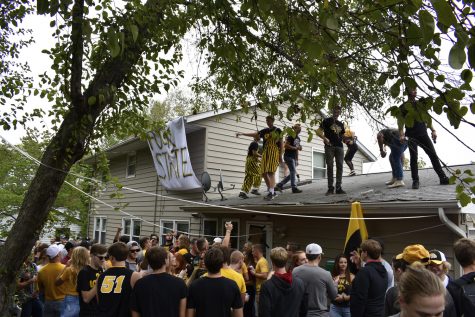 Fans tailgate and party at a house on Greenwood Drive on Saturday, Sept. 8, 2018. 