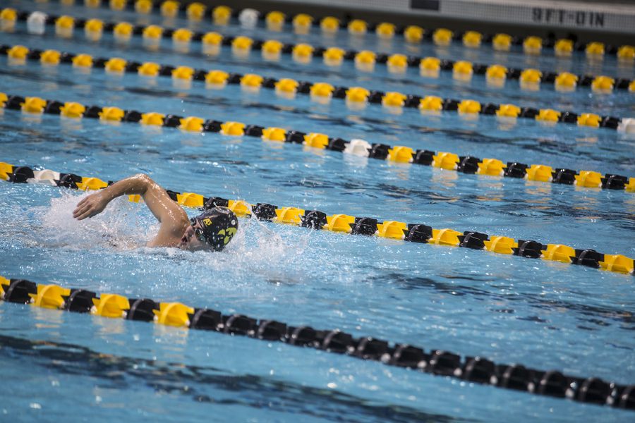 A swimmer competes in a freestyle event during the Iowa Swimming and Diving Intrasquad Meet at the Campus Recreation and Wellness Center on Saturday, Sept. 29, 2018.