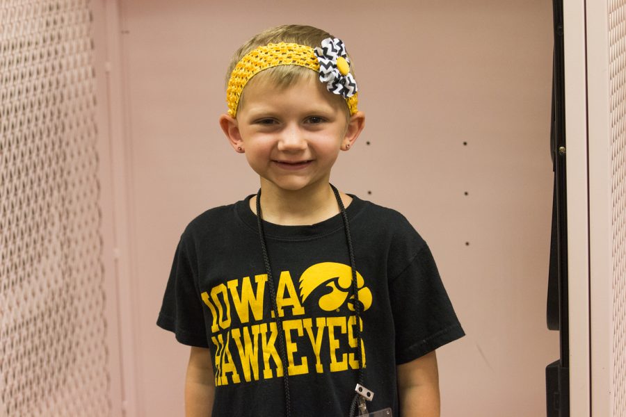Kid+Captain+Harper+Stribe+smiles+for+a+portrait+during+Iowa+football+Kids+Day+at+Kinnick+Stadium+on+Saturday%2C+Aug.+11%2C+2018.+The+2018+Kid+Captains+met+the+Iowa+football+team+and+participated+in+a+behind-the-scenes+tour+of+Kinnick+Stadium.+