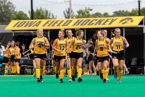 Iowa field hockey players run onto the field before a game against Ball State on Sunday, Sept. 2, 2018. The Hawkeyes defeated the Cardinals 7–1.