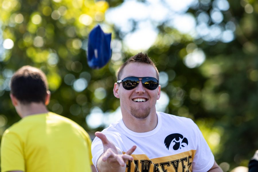 Brandon Vogl of Iowa City plays bags in the Myrtle Ave. lot while tailgating before the Iowa-Wisconsin football game on Saturday, Sep. 22, 2018. (David Harmantas/The Daily Iowan)